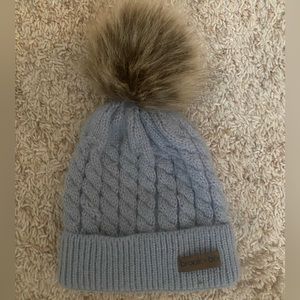 Gray hat with fuzzy top, small child (1-3 year old I’m guessing), only worn once